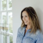 portrait-of-smiling-mature-woman-at-home-leaning-a-2022-03-08-01-24-48-utc-scaled